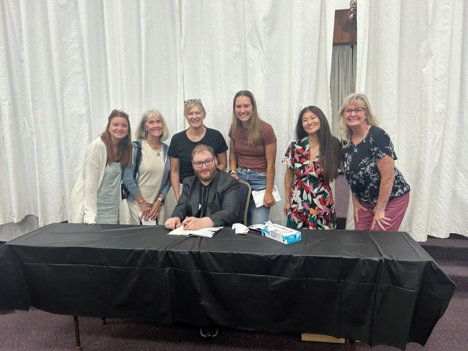 David Last with readers at a signing table