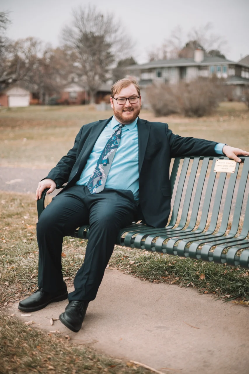 David Last seated on a park bench.