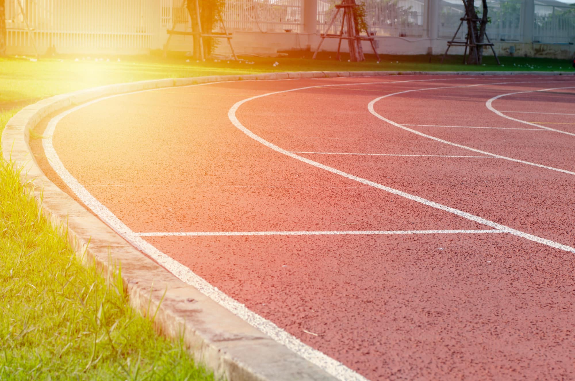 Sunlit lanes on a running track